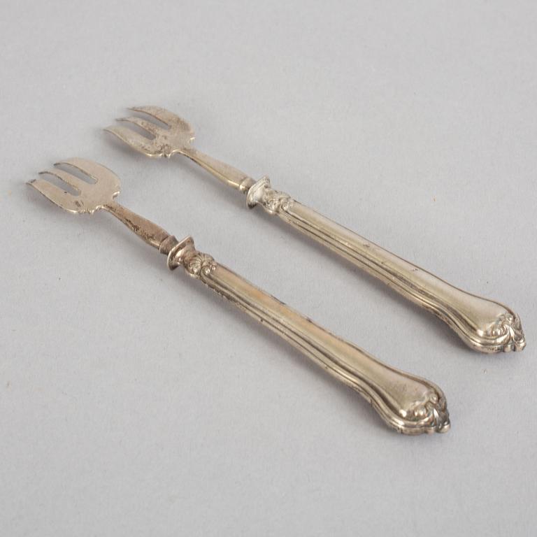 A set of twelve French 19th century silver oyster forks, mark of Hippolyte Thomas, Paris.