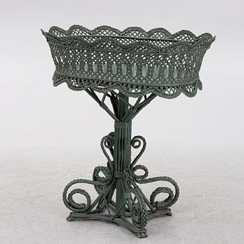 A wicker flower table, early 20th century.