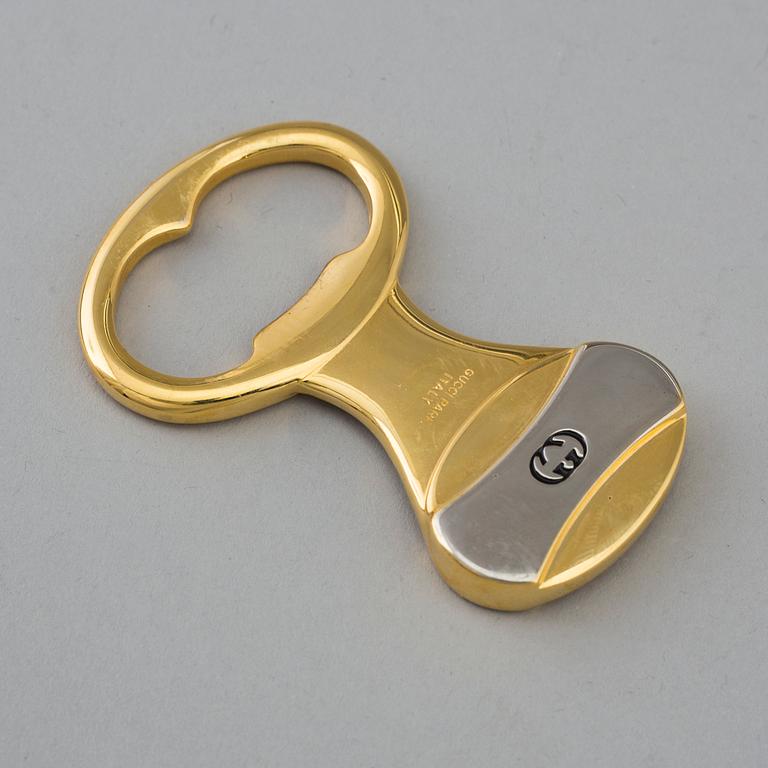 GUCCI, bottle opener.