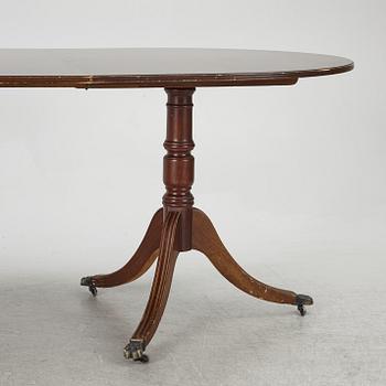 A dining table, 20th century, England.