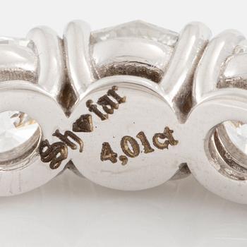 Ring, full eternity, 18K white gold set with fancy-cut diamonds.