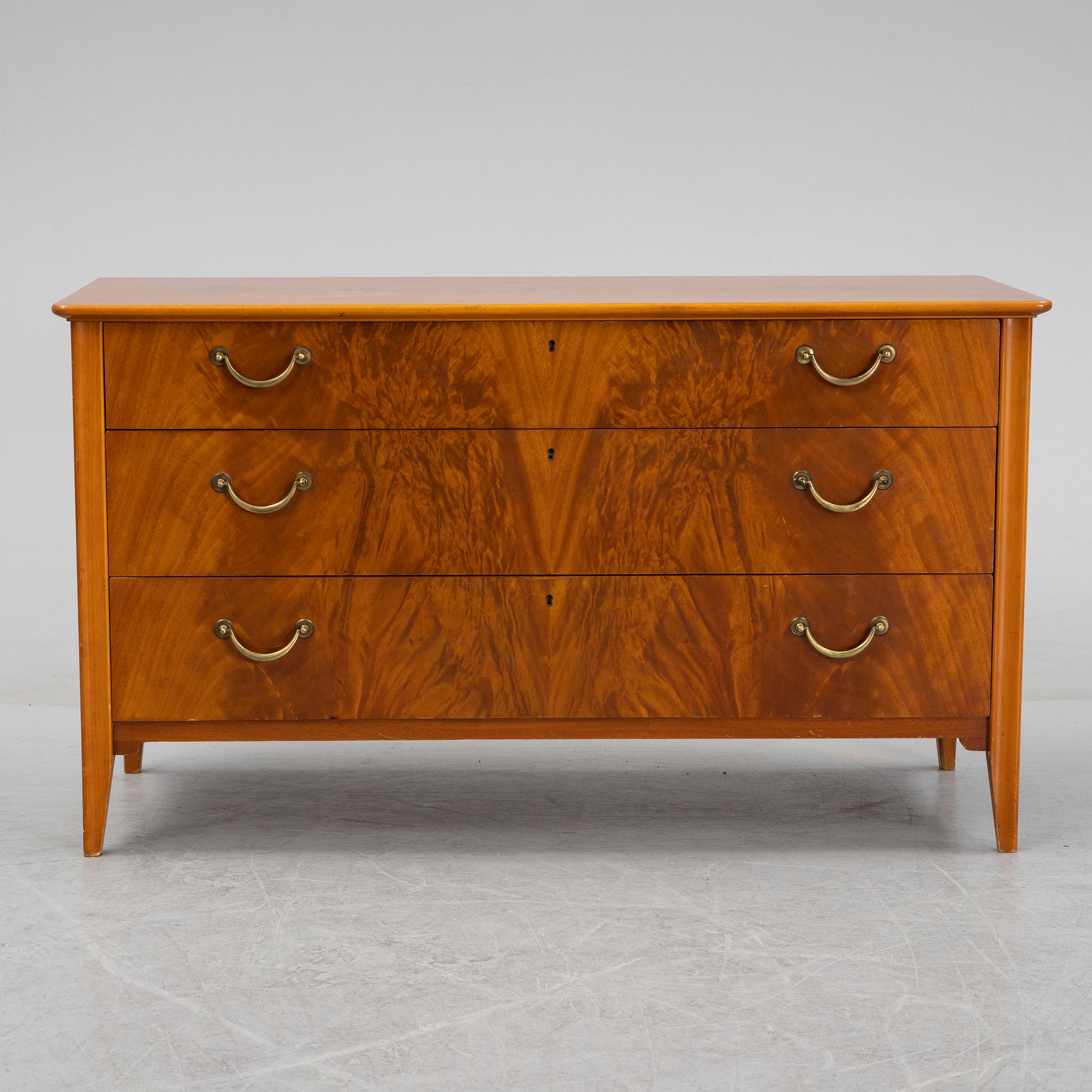 A Swedish Modern mahogany chest of drawers, 1940's/50's.