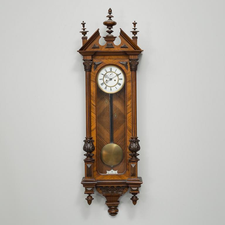 A late 19th century wall pendulum clock.