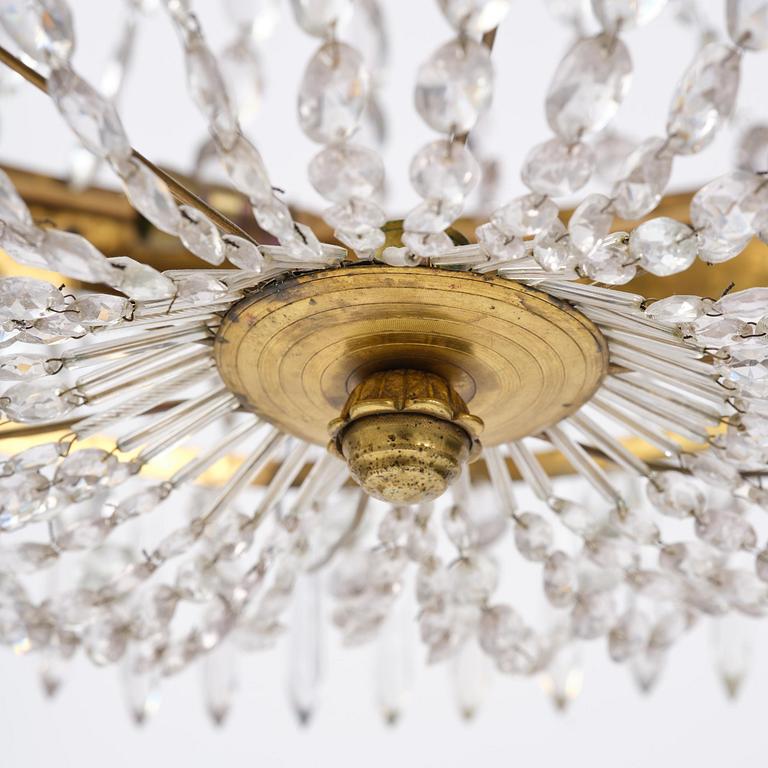 A Swedish late Empire gilt brass nine-light chandelier, 1830's.