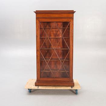 A mahogany Empire mid 19th century book cabinet.