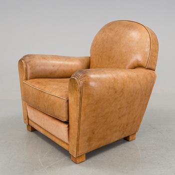 A brown leather armchair by grange, the second half of the 20th century.