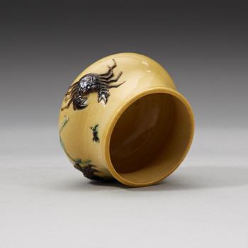 A yellow brush pot, Qing dynasty with Daoguang mark and period (1821-1850).