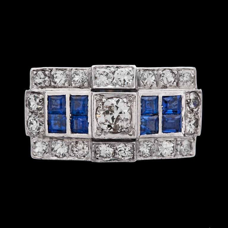 A diamond and blue sapphire ring, 1950's.