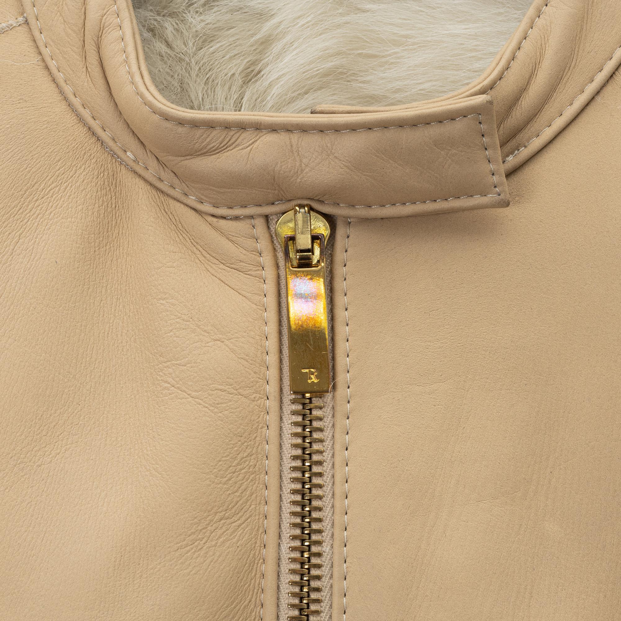 The row, a sheepskin coat, size 2.