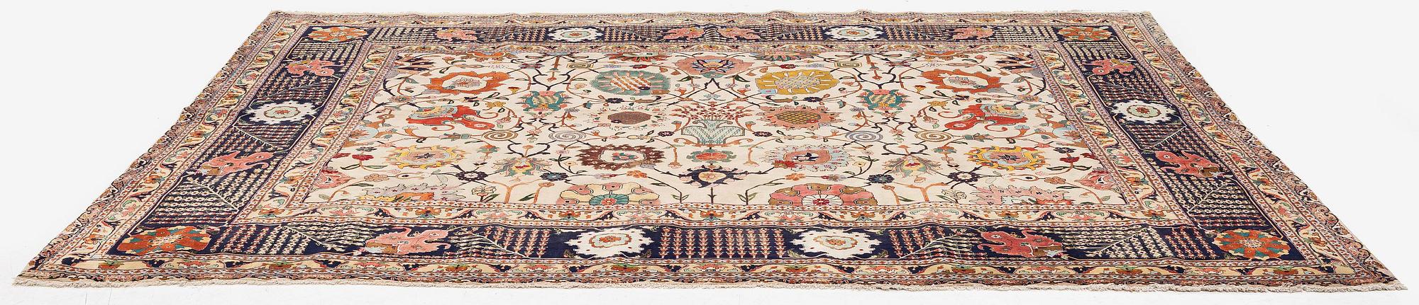 A semi-antique Tabriz carpet, Northwest Persia, of Safavid 'Vase' design, c.328 x 242 cm.