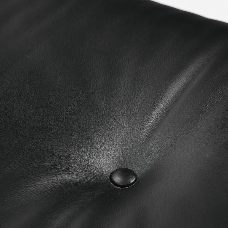 Charles & Ray Eames, an "Eames Lounge Chair" with ottoman, Vitra, 2000s.