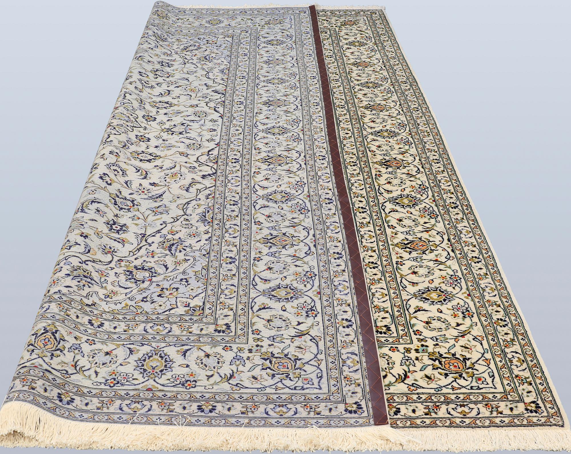 A Keshan carpet, approx. 353 x 251 cm.
