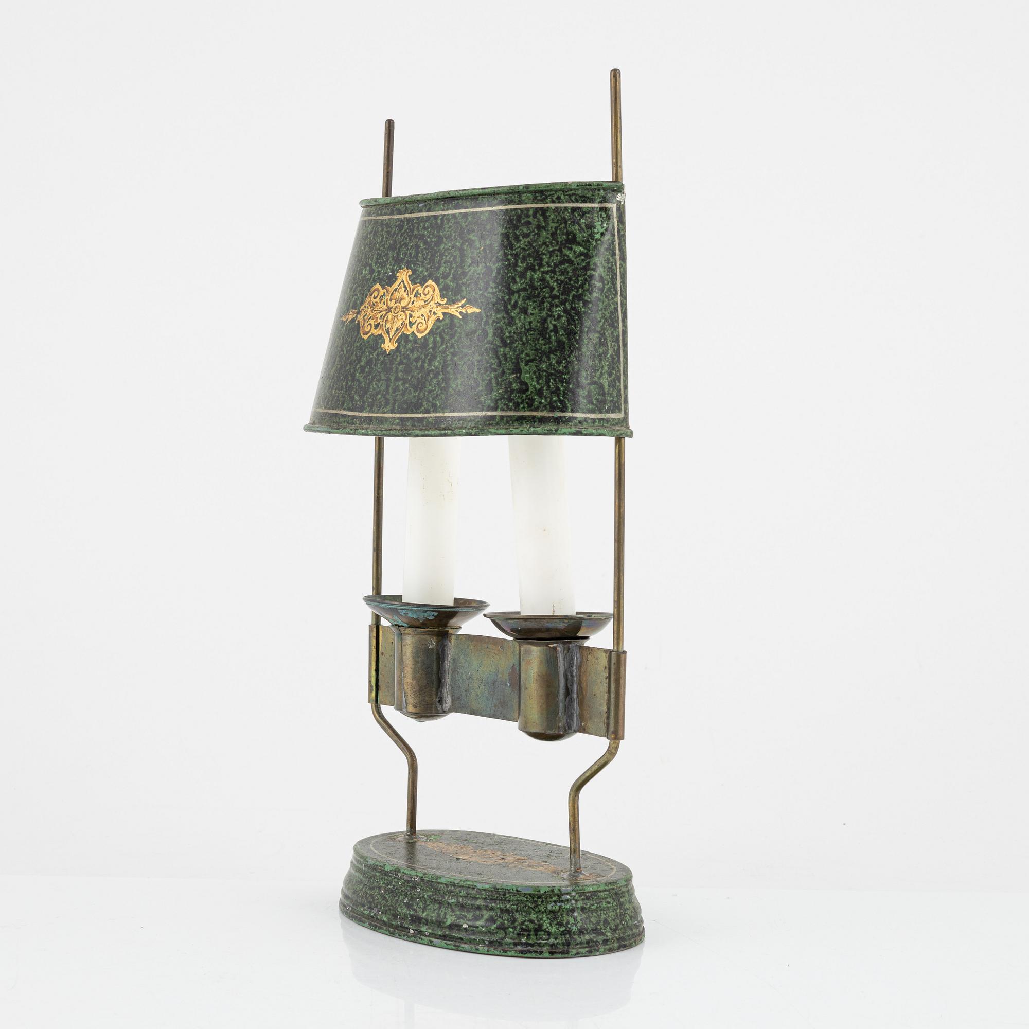 An empire style candlestick, circa 1900.