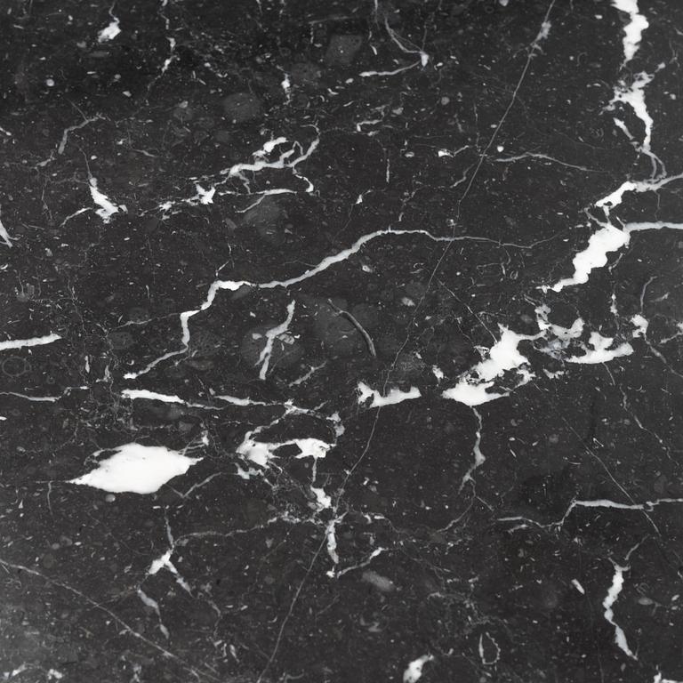 Louise Roe, a 'Roundabout' dining table with marble top.