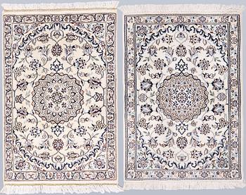 A pair of Nain rugs, part silk, so-called 9LAA, approx. 100 x 70 cm.