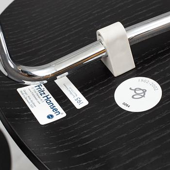 An Arne Jacobsen "Centenary Package" comprising three "Ant Chairs" and an eggshaped table, Fritz Hansen, Denmark.