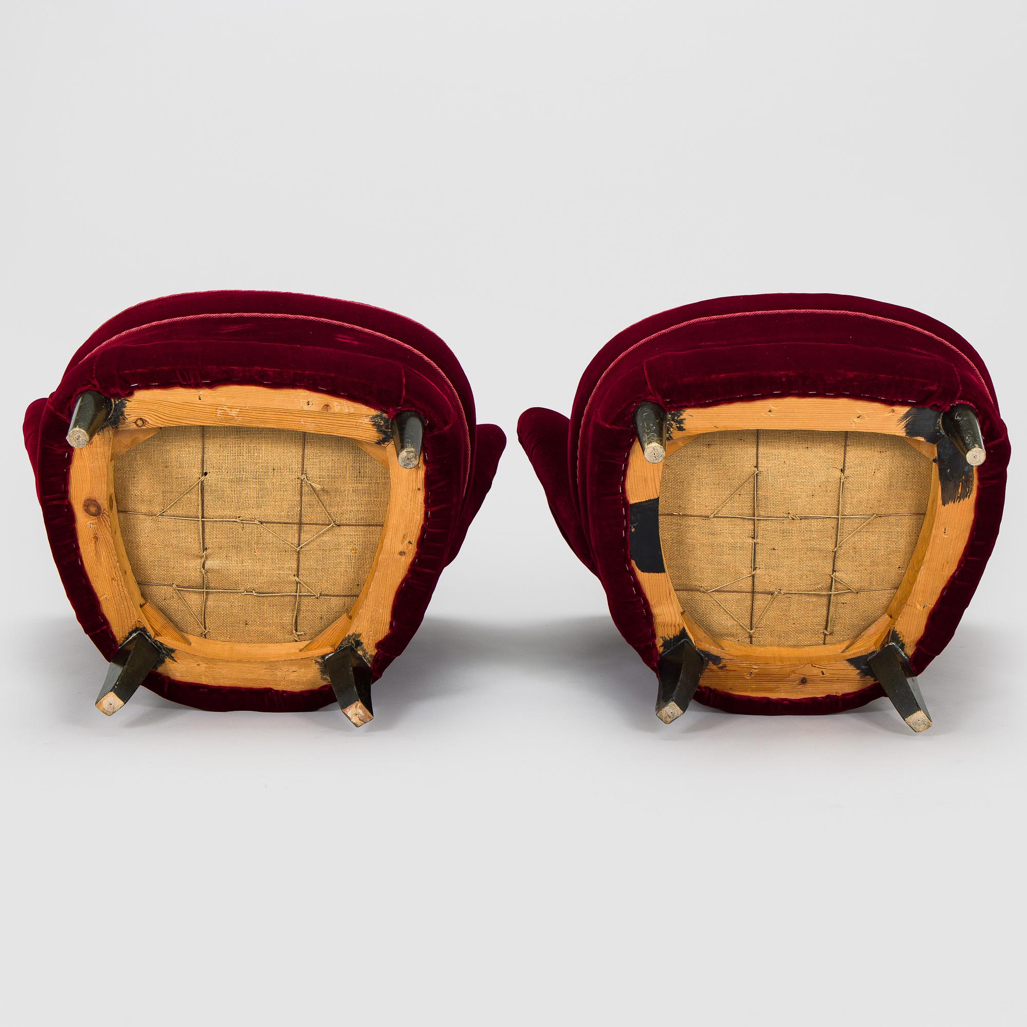 A pair of mid-20th century armchairs.