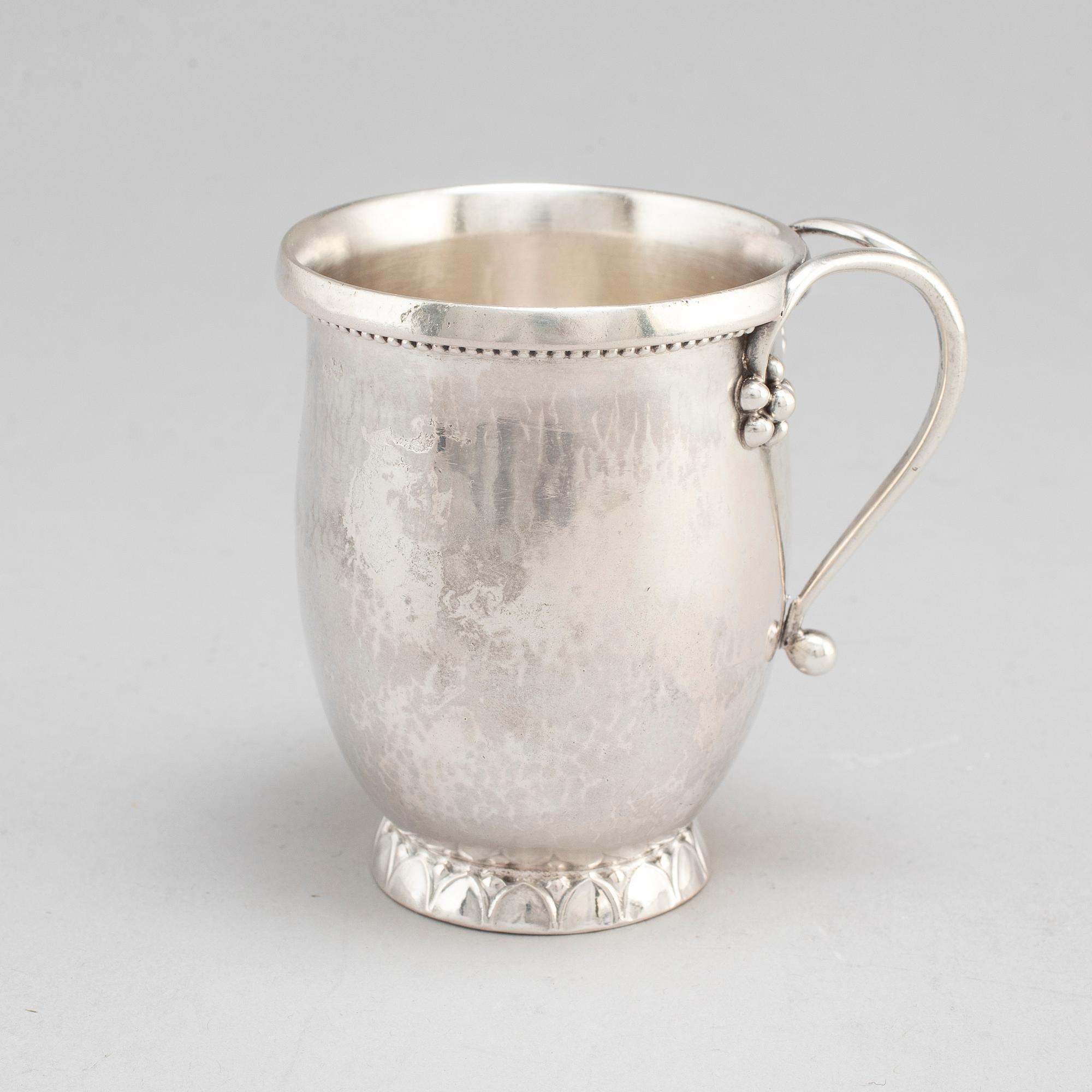 GEORG JENSEN,  a 830/1000 silver mug and  a bowl (a christening set), Copenhagen ca 1918-1927, design nr 127, 158.