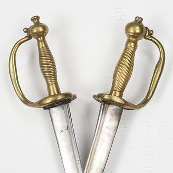 Two Swedish cutlasses 1748-1856 pattern with scabbards.