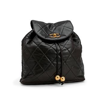 CHANEL, a black leather quilted backpack.