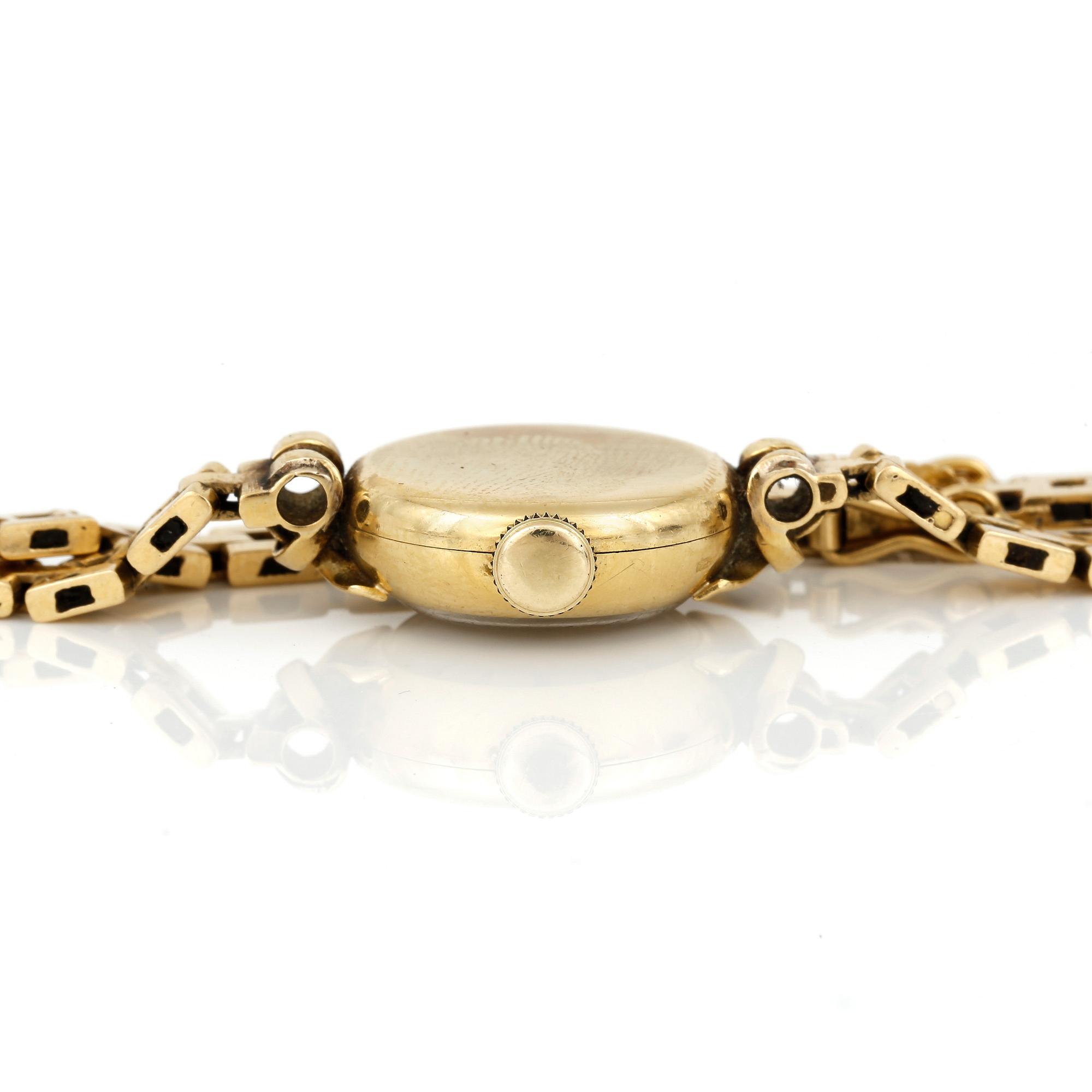 ARMBANDSUR, dam, 18K guld, 'Cyma, CymaFlex' Le Locle, Schweiz 1900-talets mitt. Total vikt ca 18,97 g.