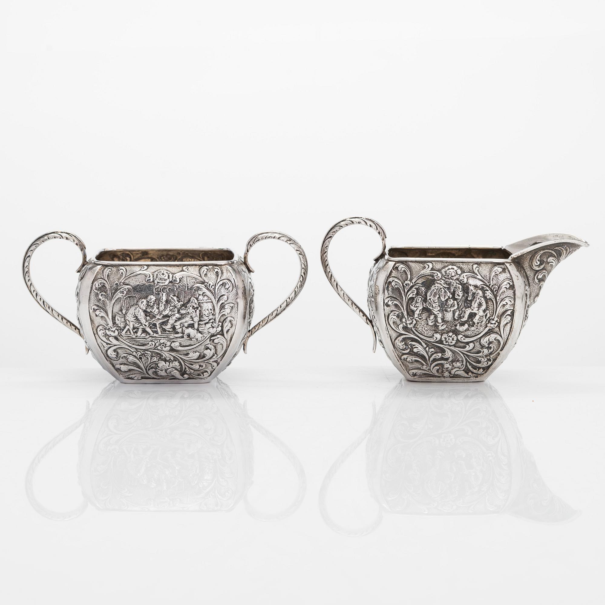 A 1940s Dutch silver sugar bowl and cream jug on a tray, Amsterdam, 1947 and 1942.