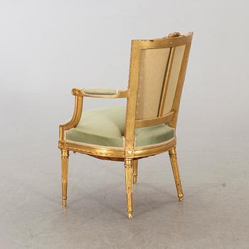 A Louis XVI-style arm chair, ca 1900.