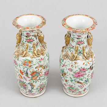 A pair of famille rose Canton vases, Qing dynasty, late 19th century.