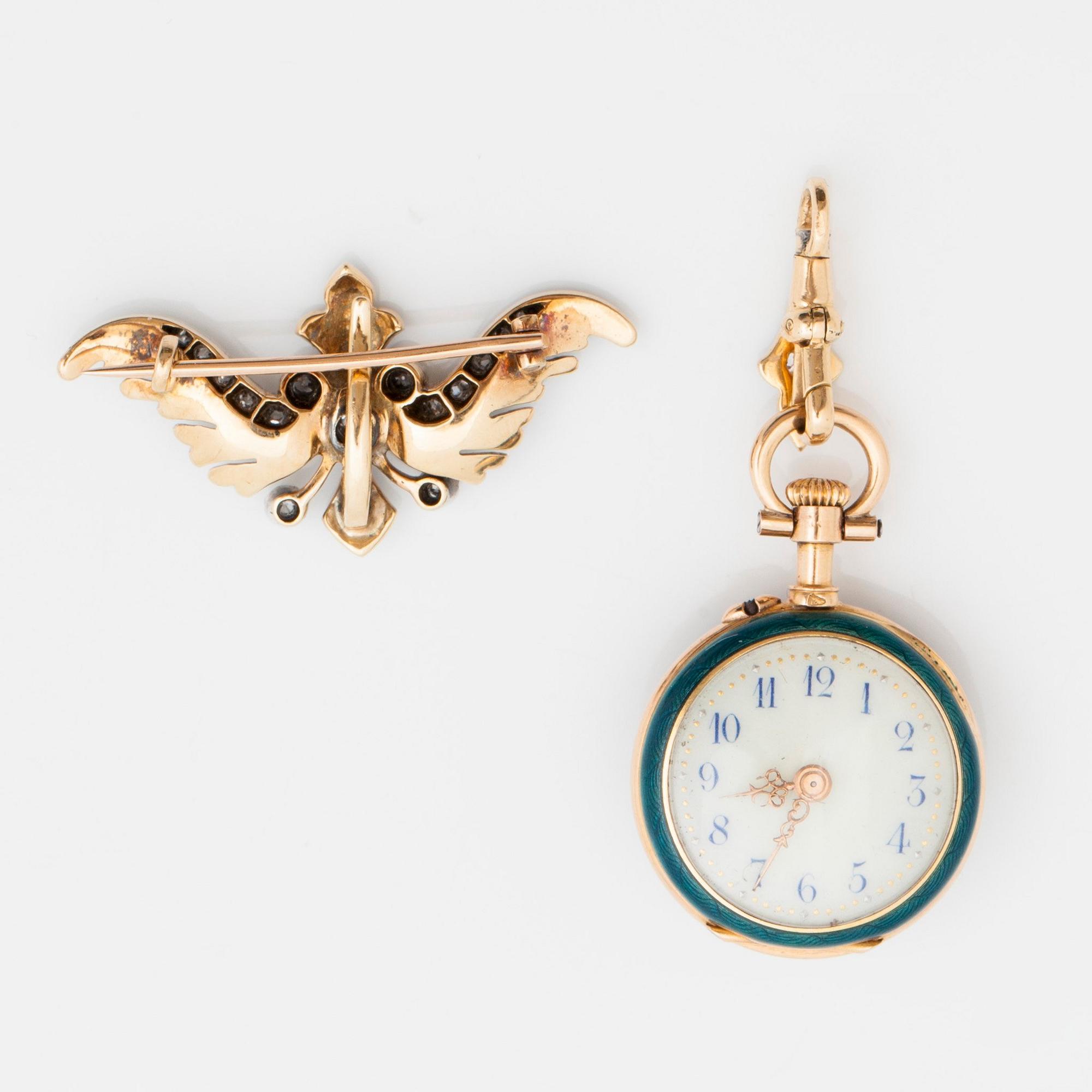 A ladies watch that can be worn as a brooch. Enamel set with diamonds. Cylinder escapement. Circa 1890-1900.