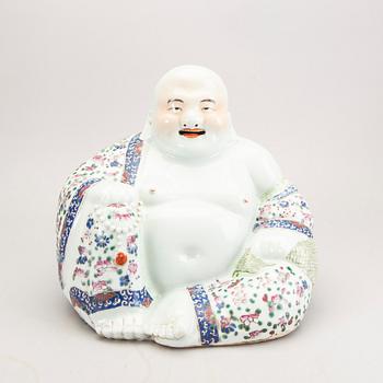 A large porcelain figure of a buddai, China, 20th Century.