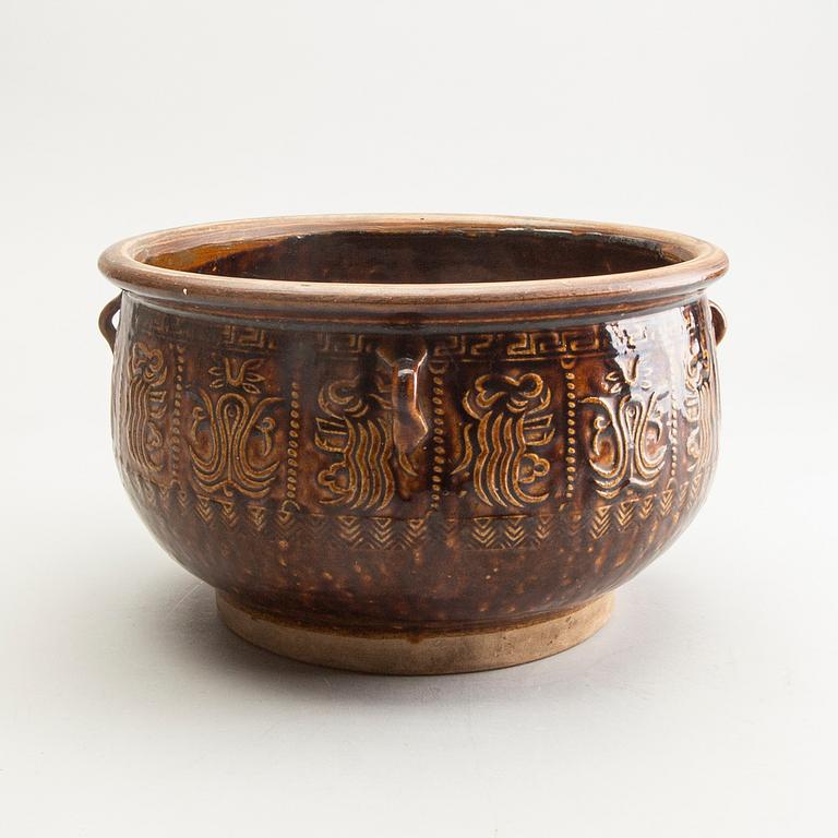 A large brown glazed jar, South East Asia, presumably 19th Century.