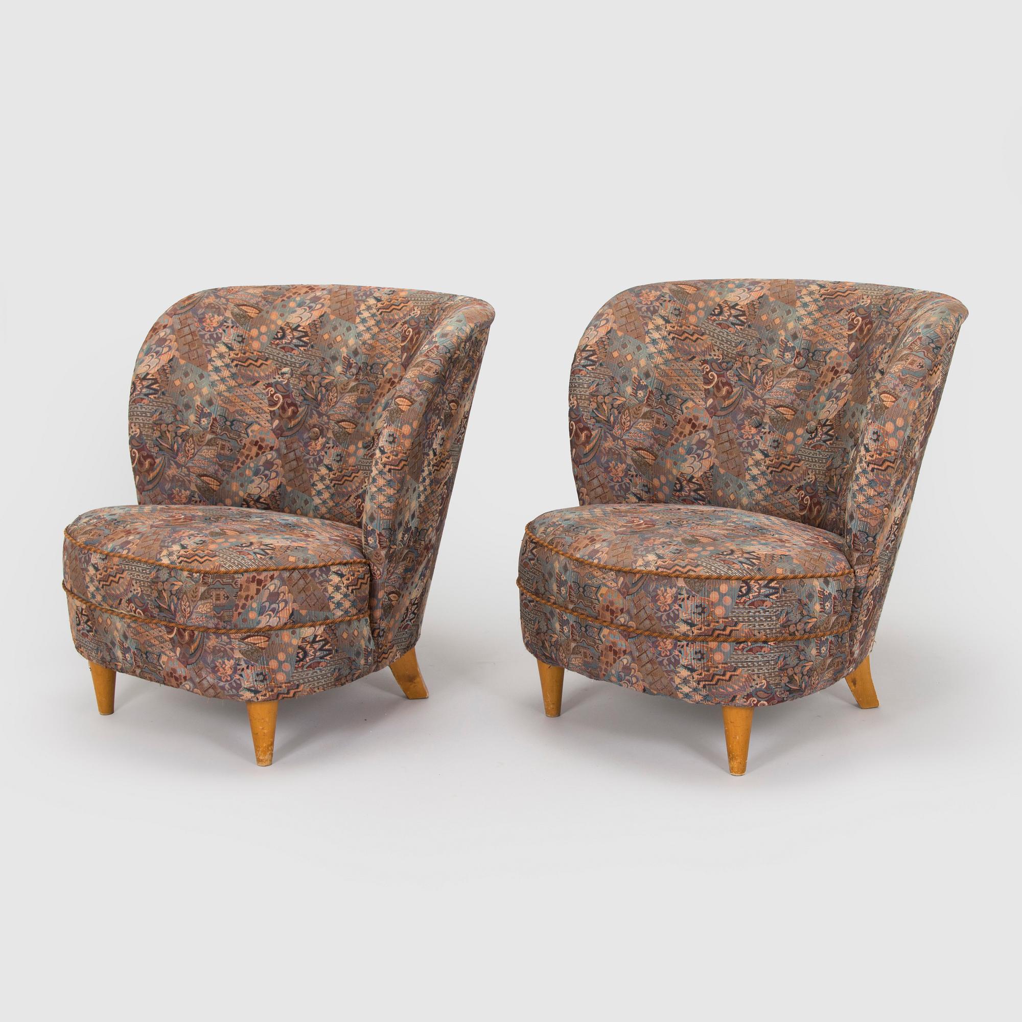 A pair of mid-20th century armchairs.