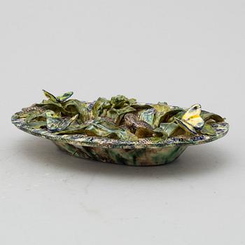 A richly decorated Palissy-style majolica plate, 19th century.