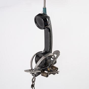 Jason Matthew Lee, hardrive magnets, animal trap, on cut and welded payphones. Executed in 2017.