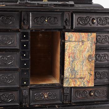 A South-German Baroque ebonized collector's cabinet on stand, circa 1700.