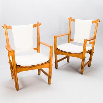LASSE OLLINKARI, a pair of 1948 open armchairs.