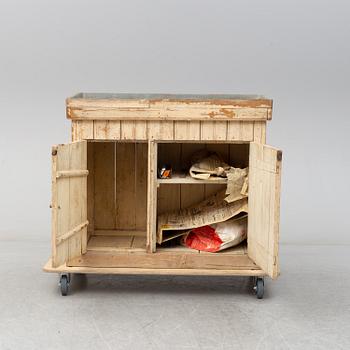 A late 19th Century cabinet with zink top.