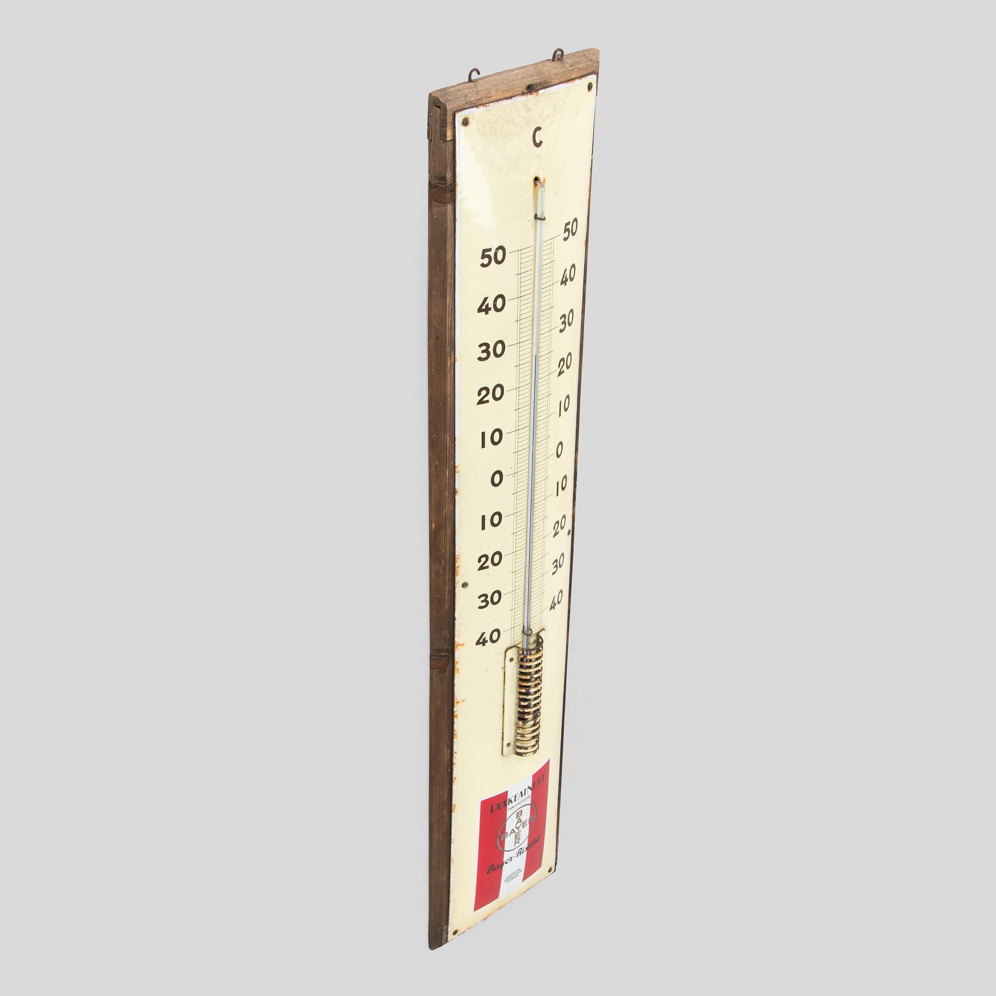 a mid-20th century outdoor thermometer.