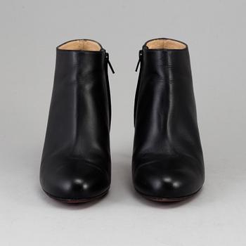 CHRISTIAN LOUIBOUTIN, a pair of black leather boots, size 40.