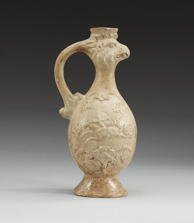 A cream-glazed pottery Phoenix-head ewer, Tang dynasty (618-907 AD).