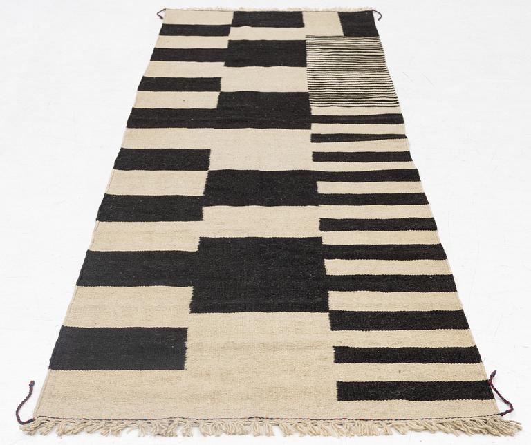 A Kilim runner, c. 293 x 87 cm.