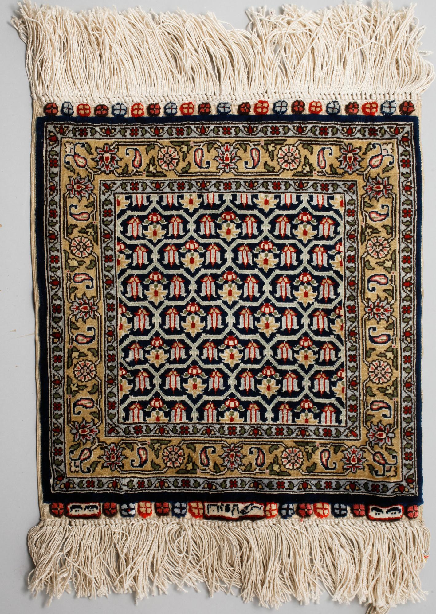 Four silk rugs/pads, probably Hereke, ca 33 x 33 cm.