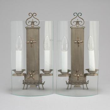 A pair of pewter wall lamps, 1920s.