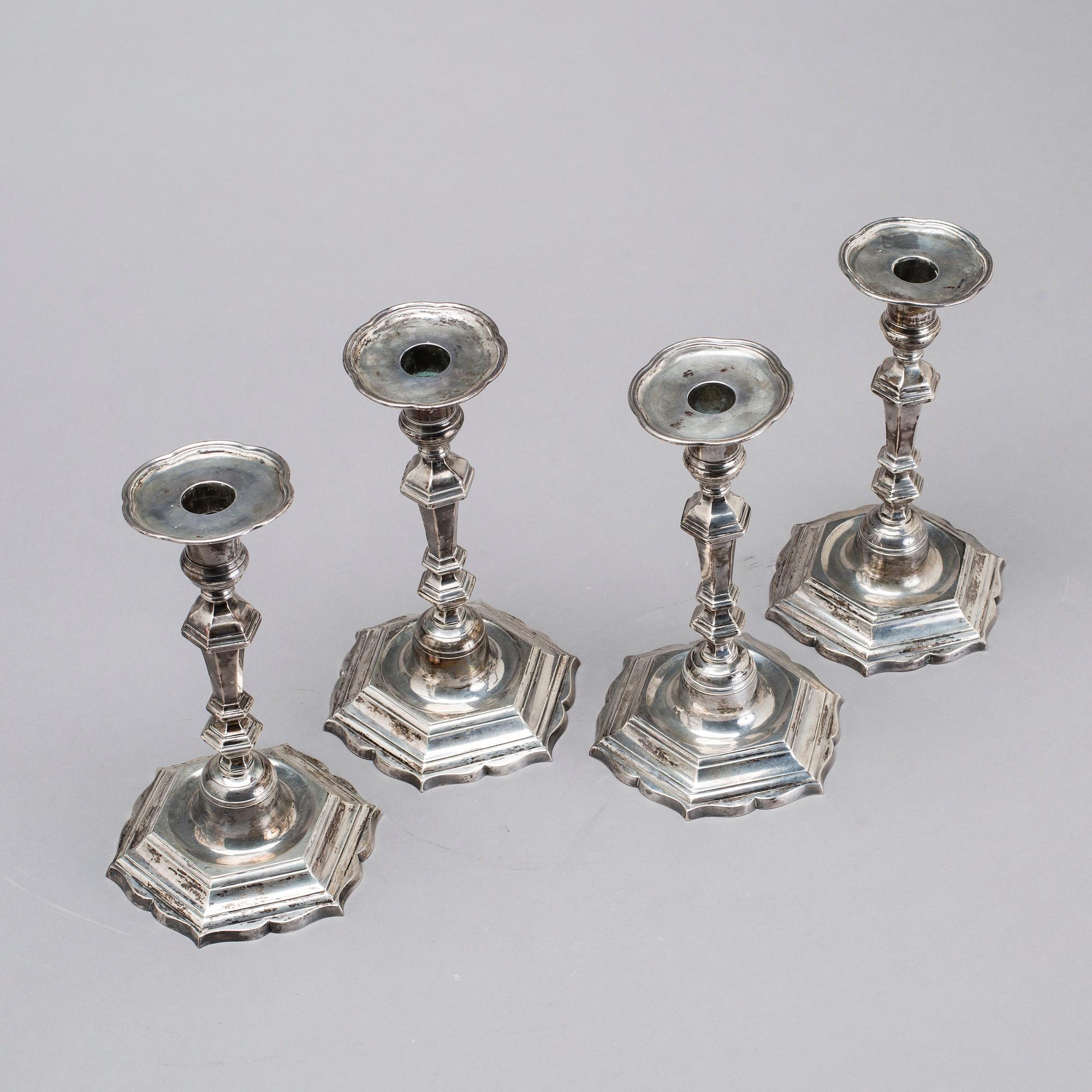 Two simular pairs of candlesticks, two marked Barde, Geneve 18th century, two with later marks.