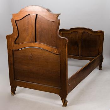 A pair of early 20th Century art nouveau style beds.