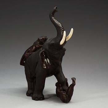 A Japanese bronze and ivory figure of an elephant attacked by two tigers, Meiji, ca 1900.