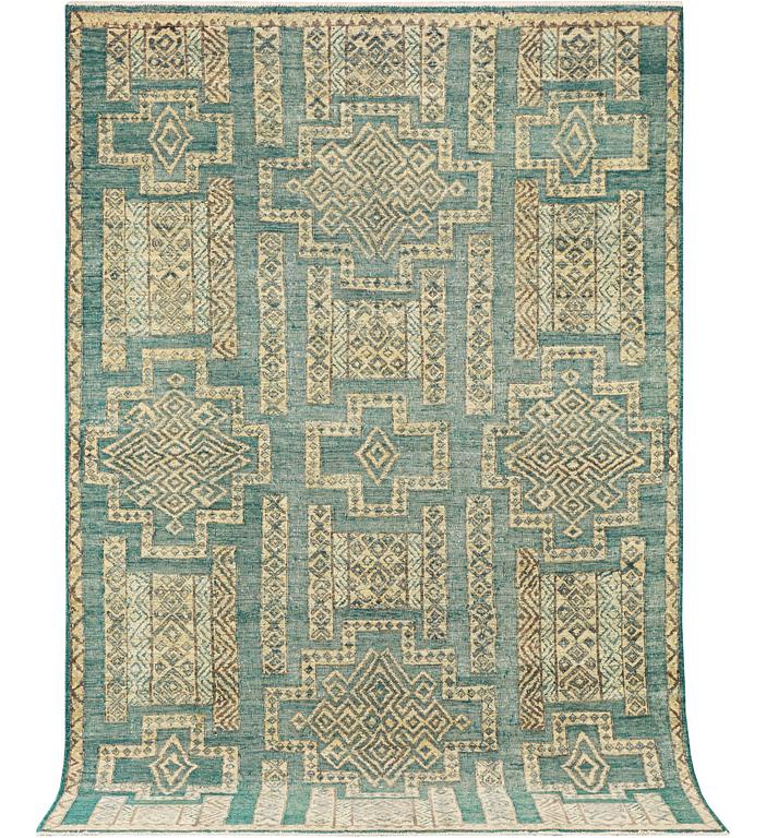 An oriental carpet with relief pattern, c. 309 x 204 cm.
