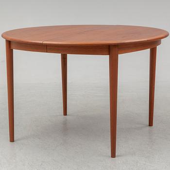 A 1960s teak veneered dining table.