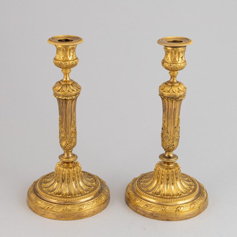 A pair of Louis XVI candlesticks.