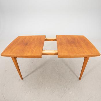 A 1950s teak dining table.